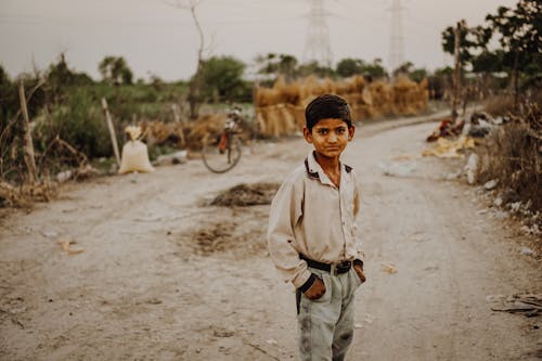 Boy Standing in Road