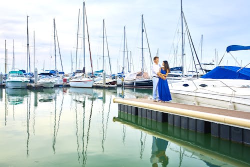Free Man and Woman Standing Near Boat Stock Photo