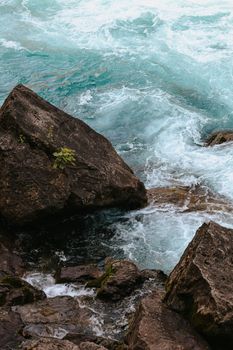 Dynamic view of water splashing over rocks at Niagara Falls, Ontario, Canada.