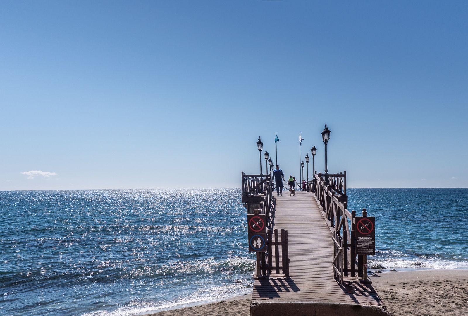 Pier view in Marbella with small boats moored