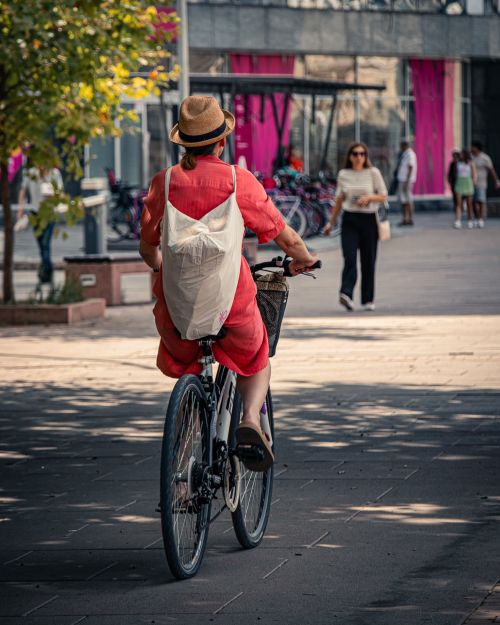 Free A person cycling through a vibrant urban street in Skopje. Stock Photo