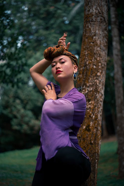 Photo Of Woman Wearing Purple Top