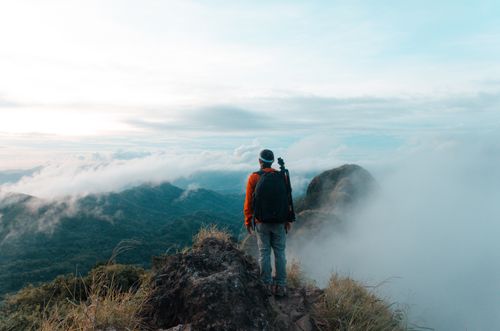 Free Explore breathtaking mountain views with clouds and a climber in the Philippines. Stock Photo
