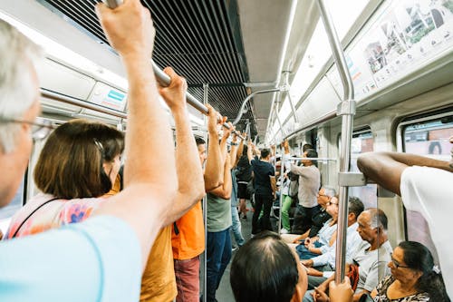 Metro train full of people during busy day