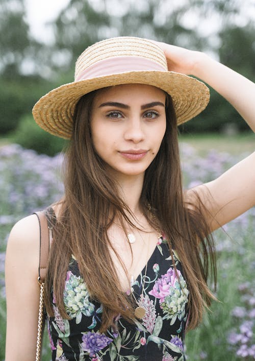 Free Woman Holding Her Hat Stock Photo