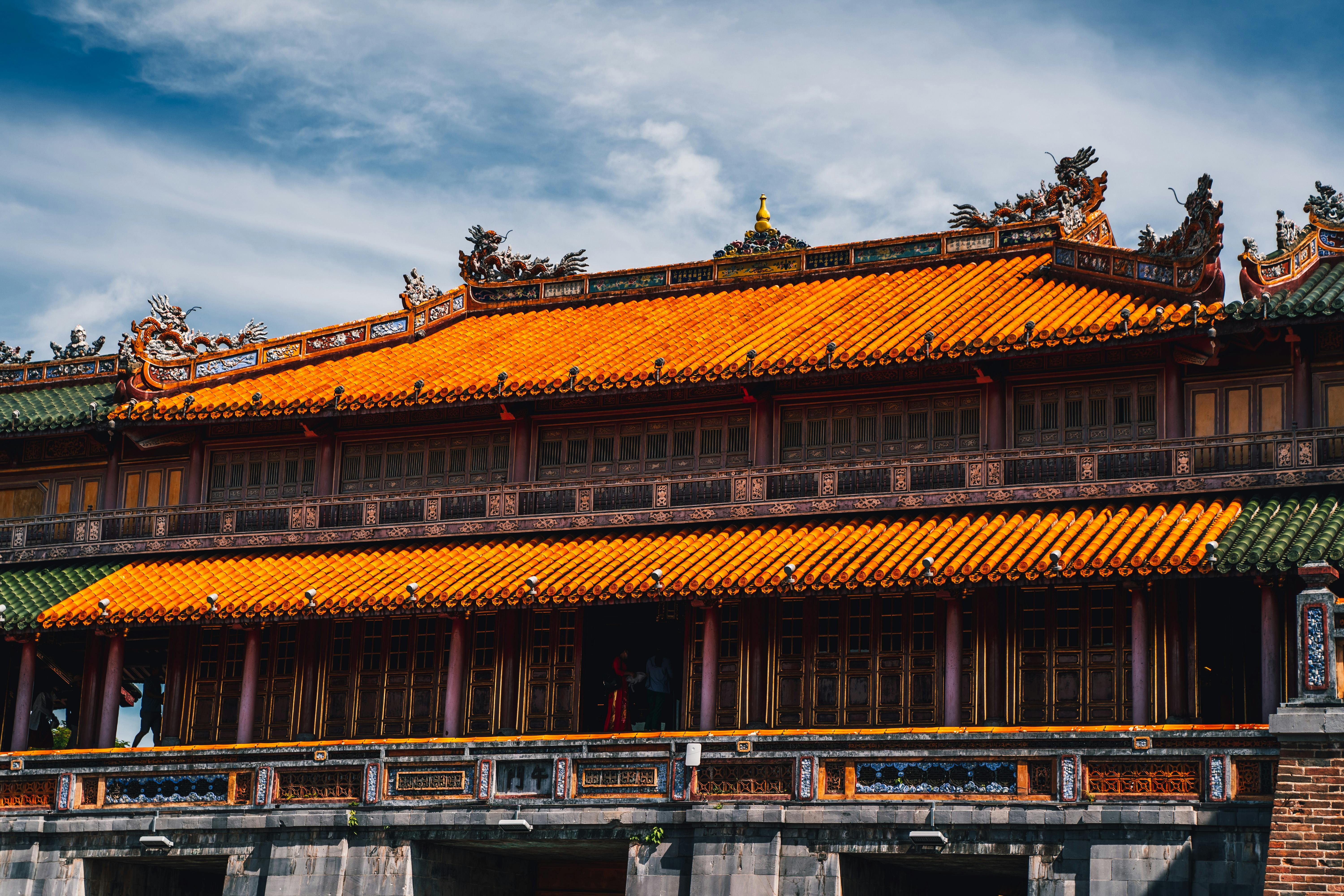 Captivating image of traditional Vietnamese architecture showcasing vibrant roof design in Hue.