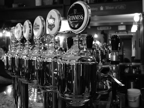 Grayscale Photography of Beer Dispenser