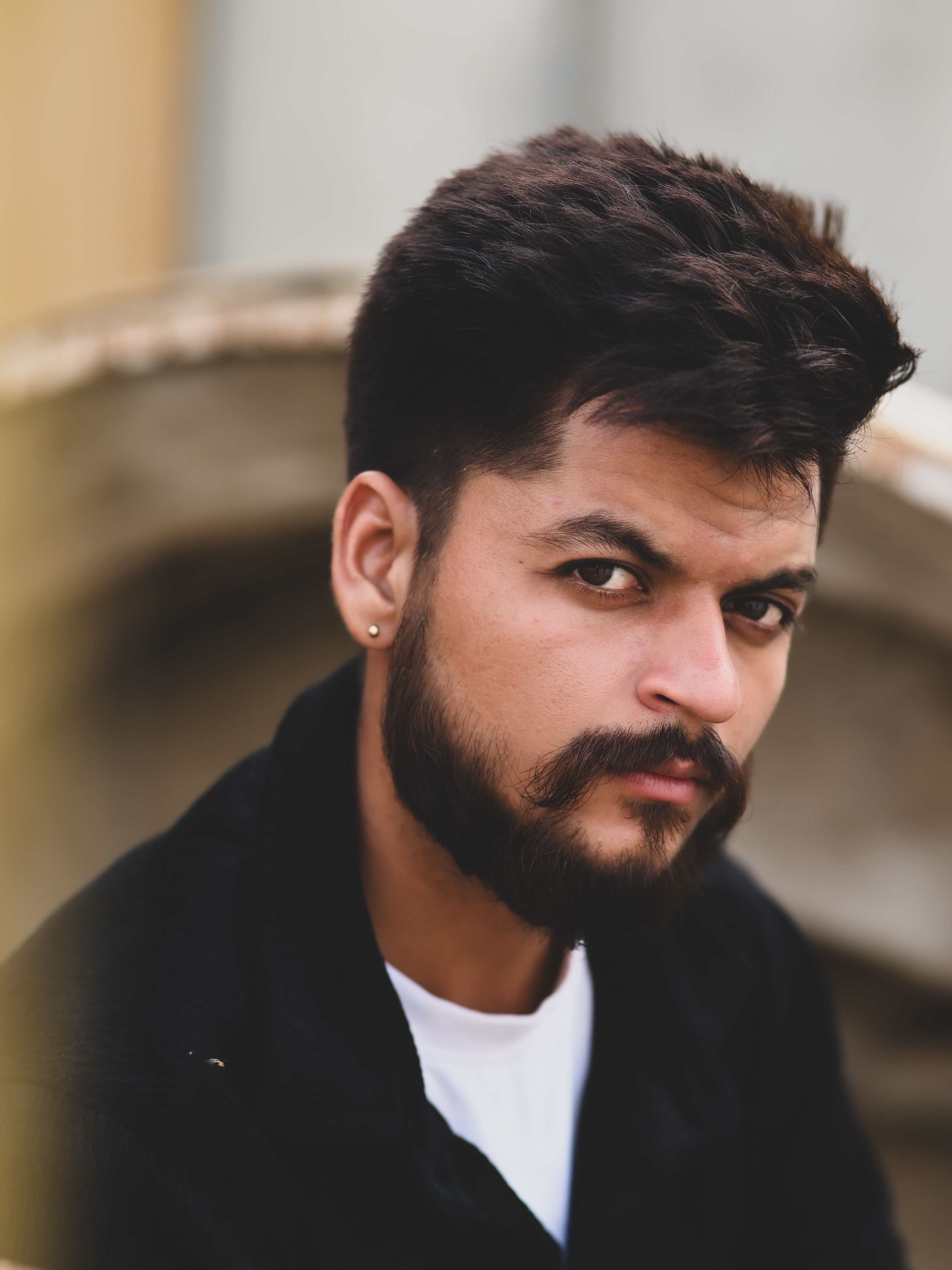 Portrait of a pensive young man outdoors in Sahibzada Ajit Singh Nagar, India.