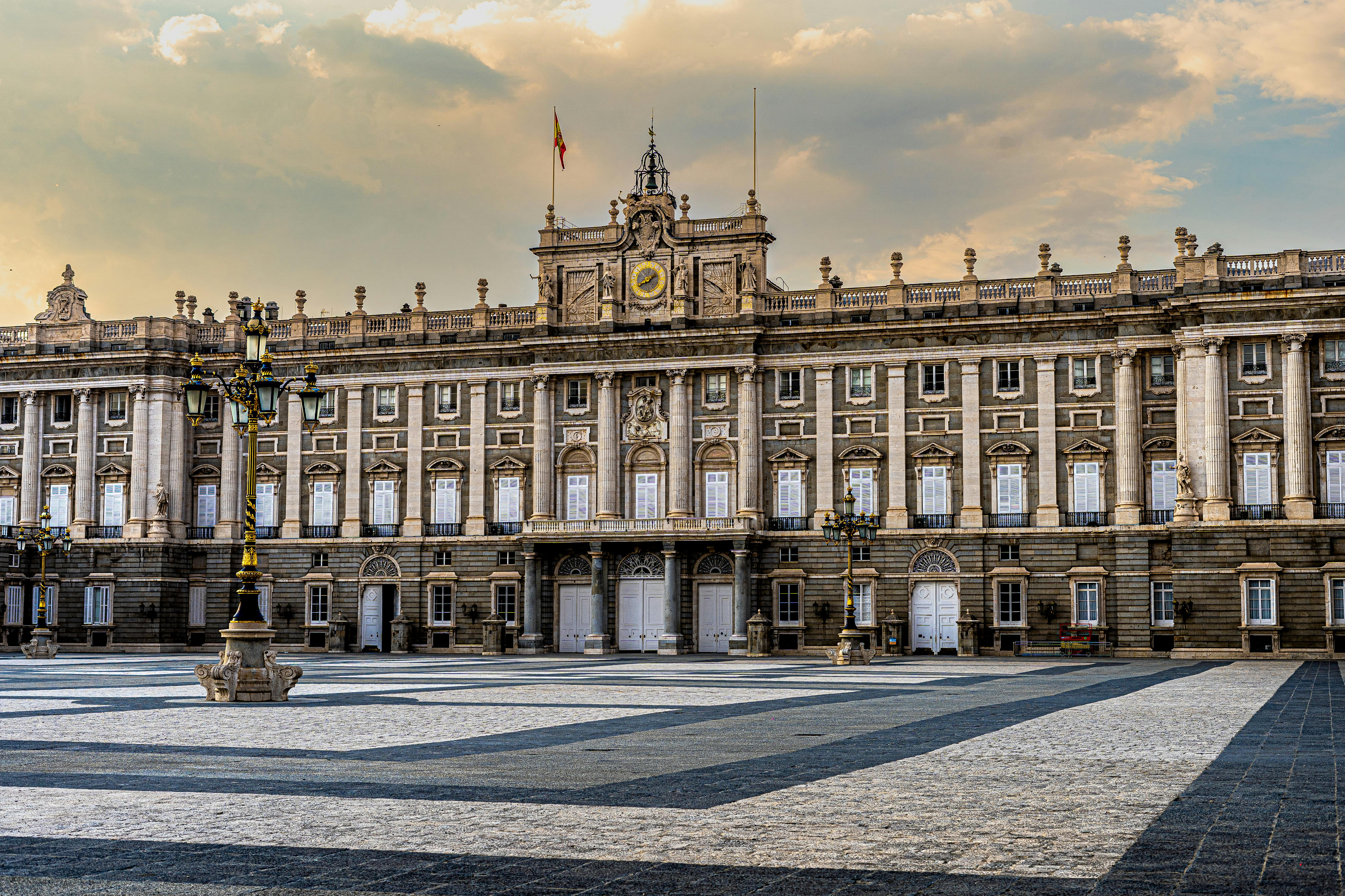 a large palace with a clock tower in the middle