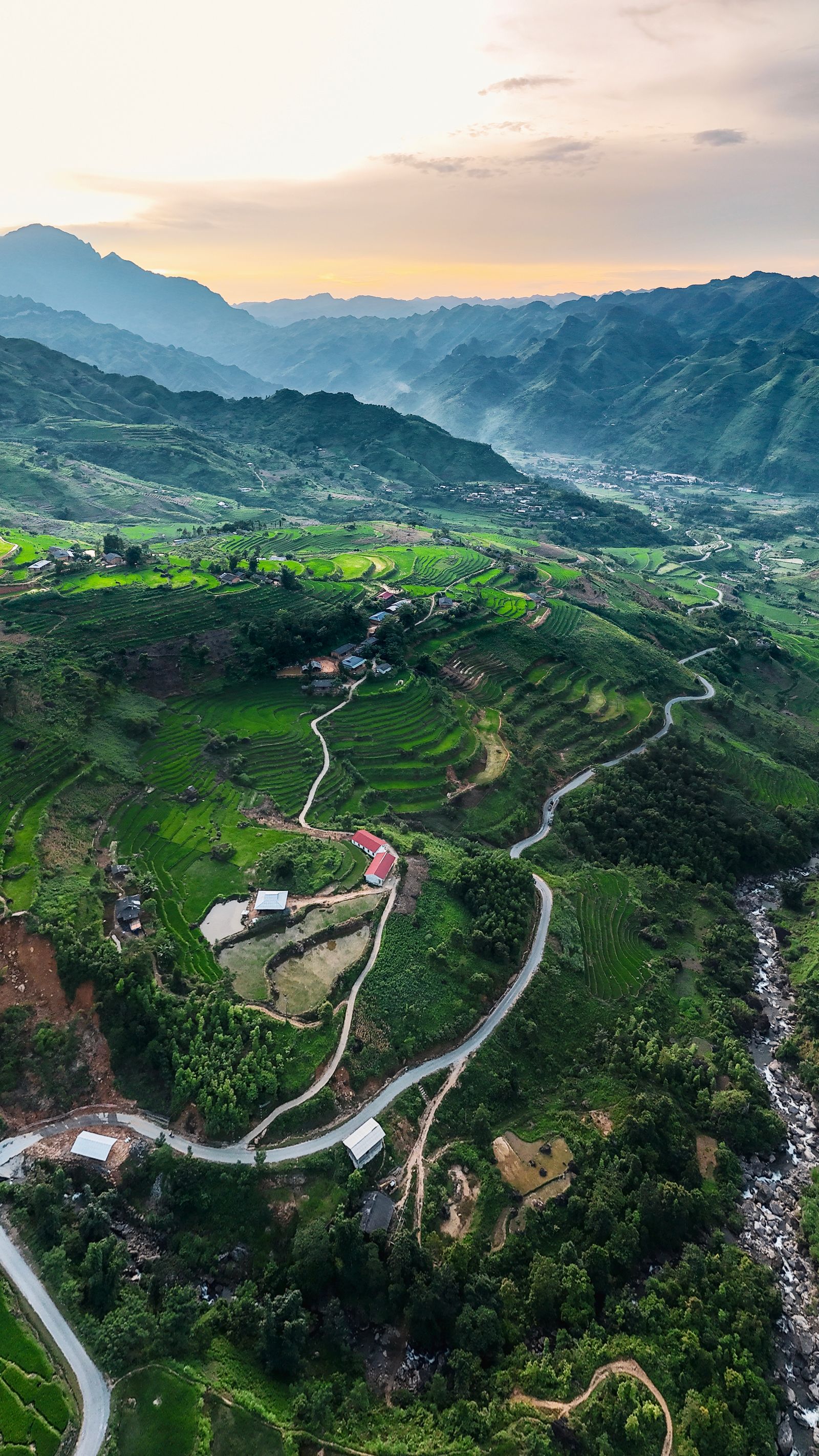Sunset over the valleys and winding roads of Ha Giang Loop in northern Vietnam