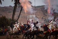 Exciting Tbourida horsemen display traditional skill at a Moroccan festival.