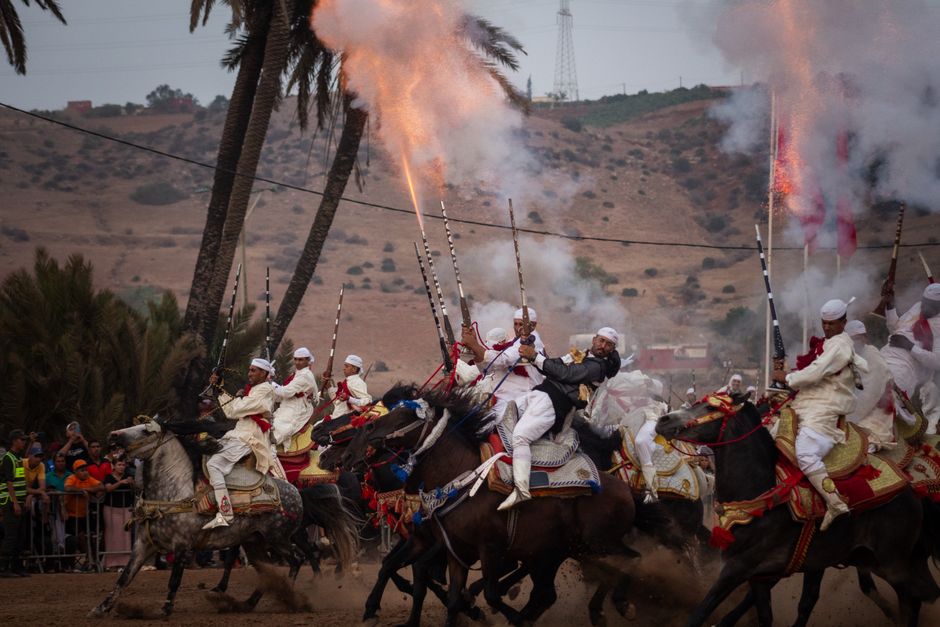 Exciting Tbourida horsemen display traditional skill at a Moroccan festival.