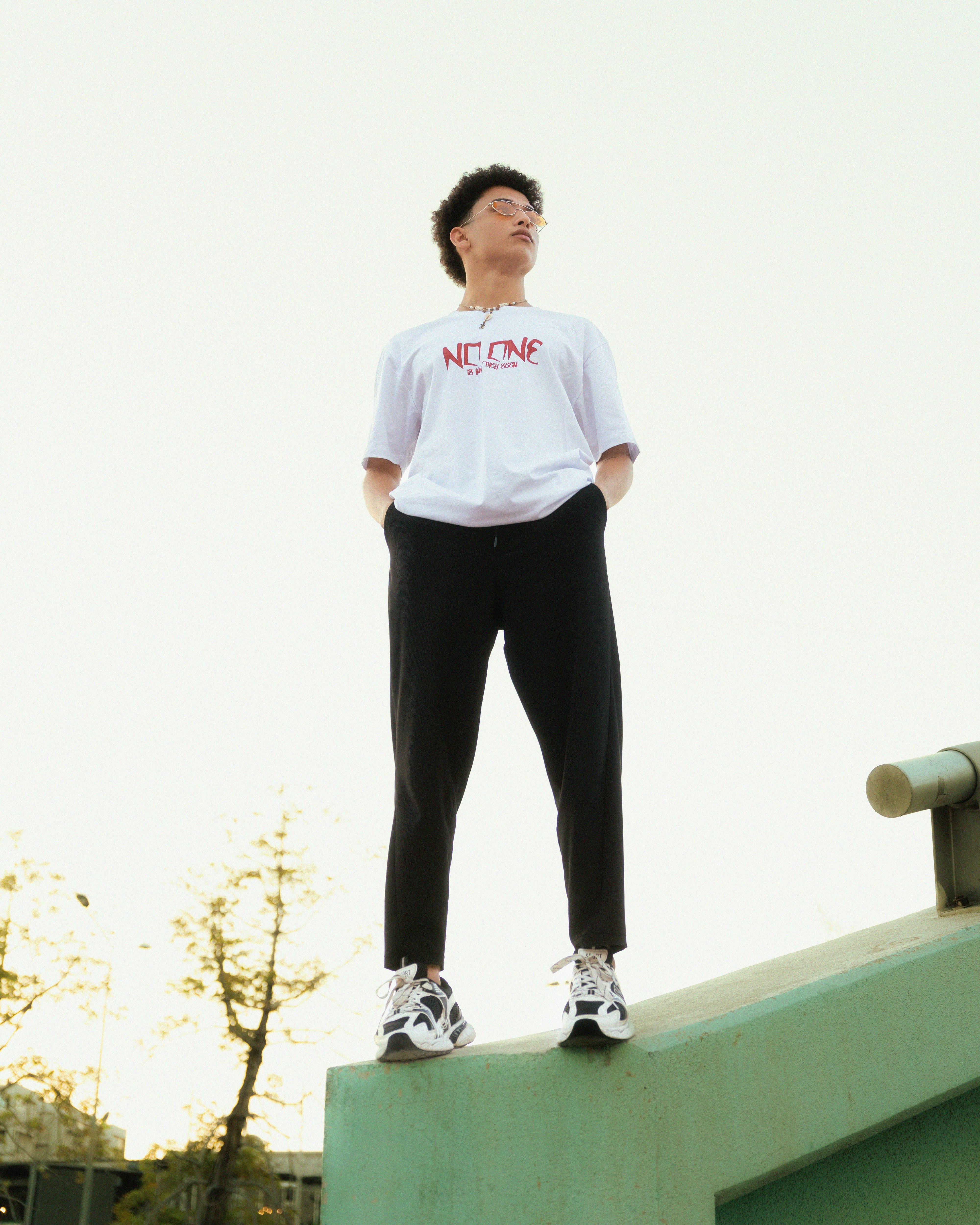 a man standing on top of a skateboard