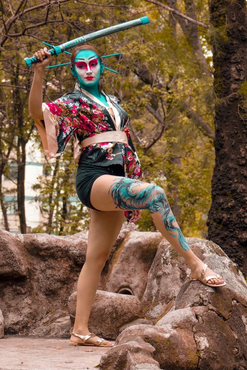 Free A striking geisha-inspired outdoor portrait with a bold artistic style and vivid colors. Stock Photo