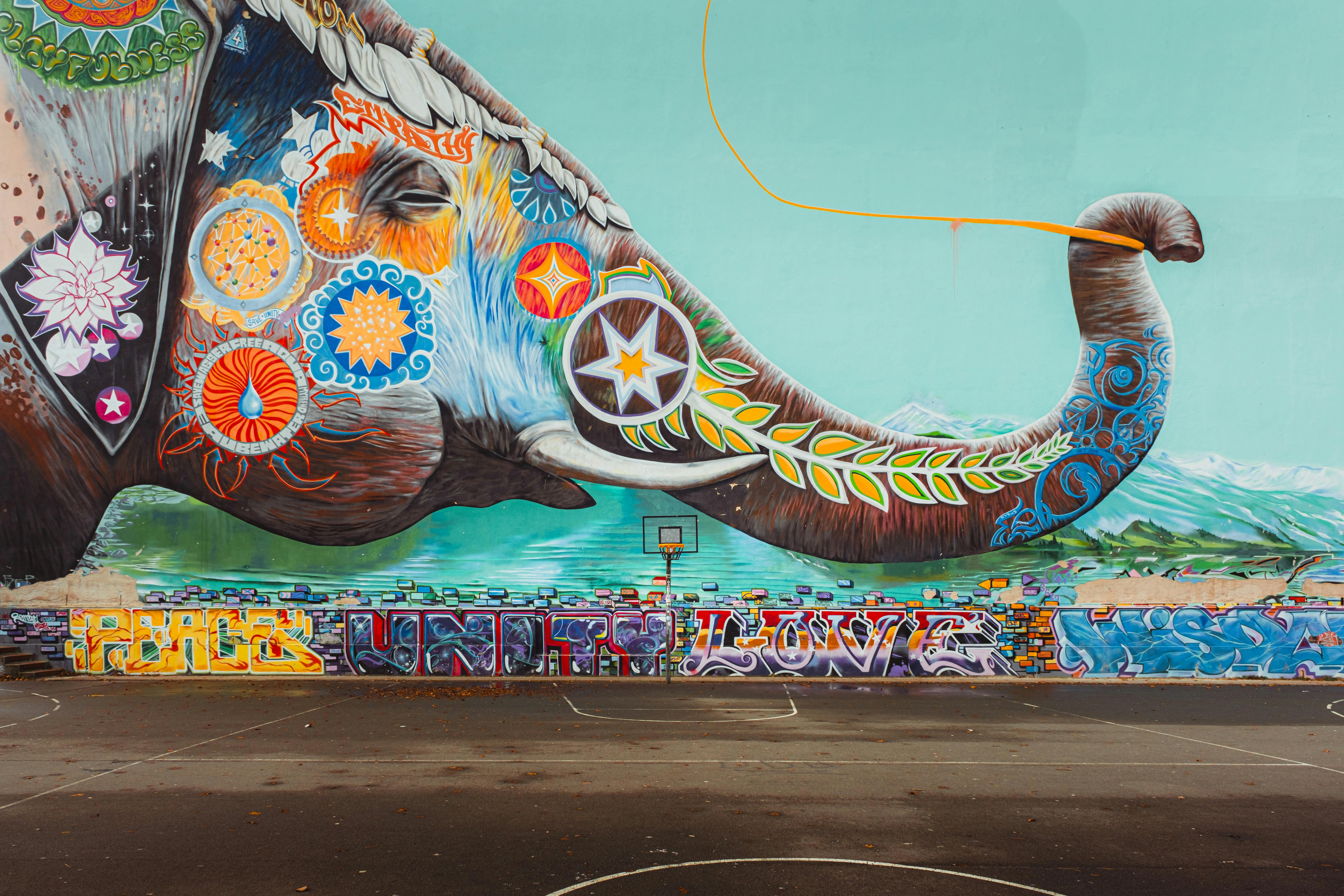 a mural of an elephant with a colorful design on it