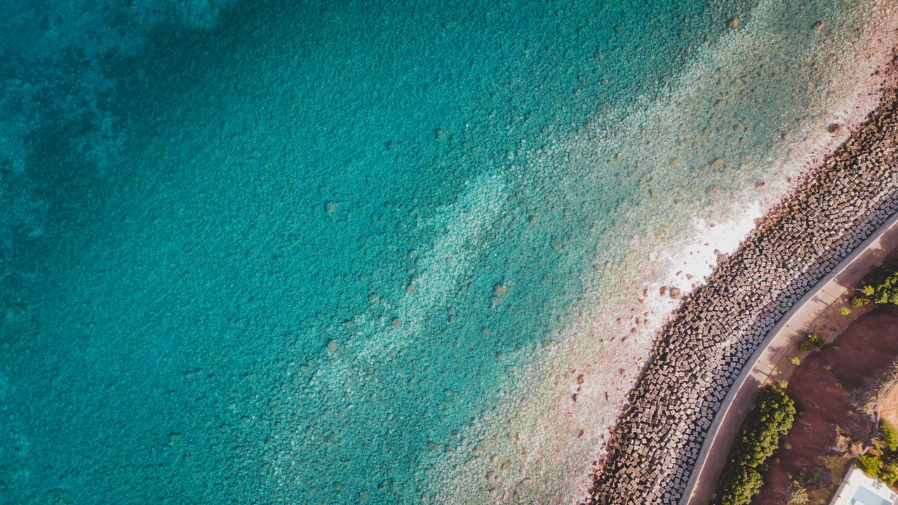 stunning aerial view of madeira s turquoise coastline and rocky shore