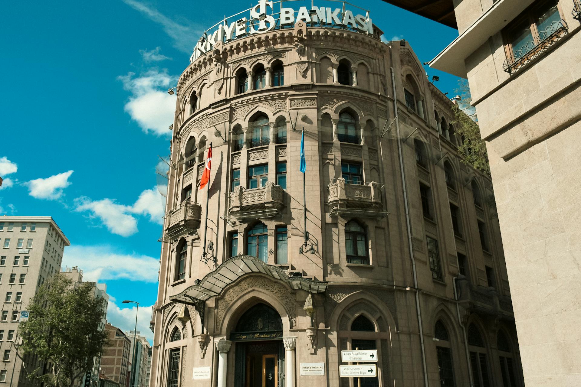 Historic İş Bankası building captures Ankara's architectural elegance under a bright blue sky.