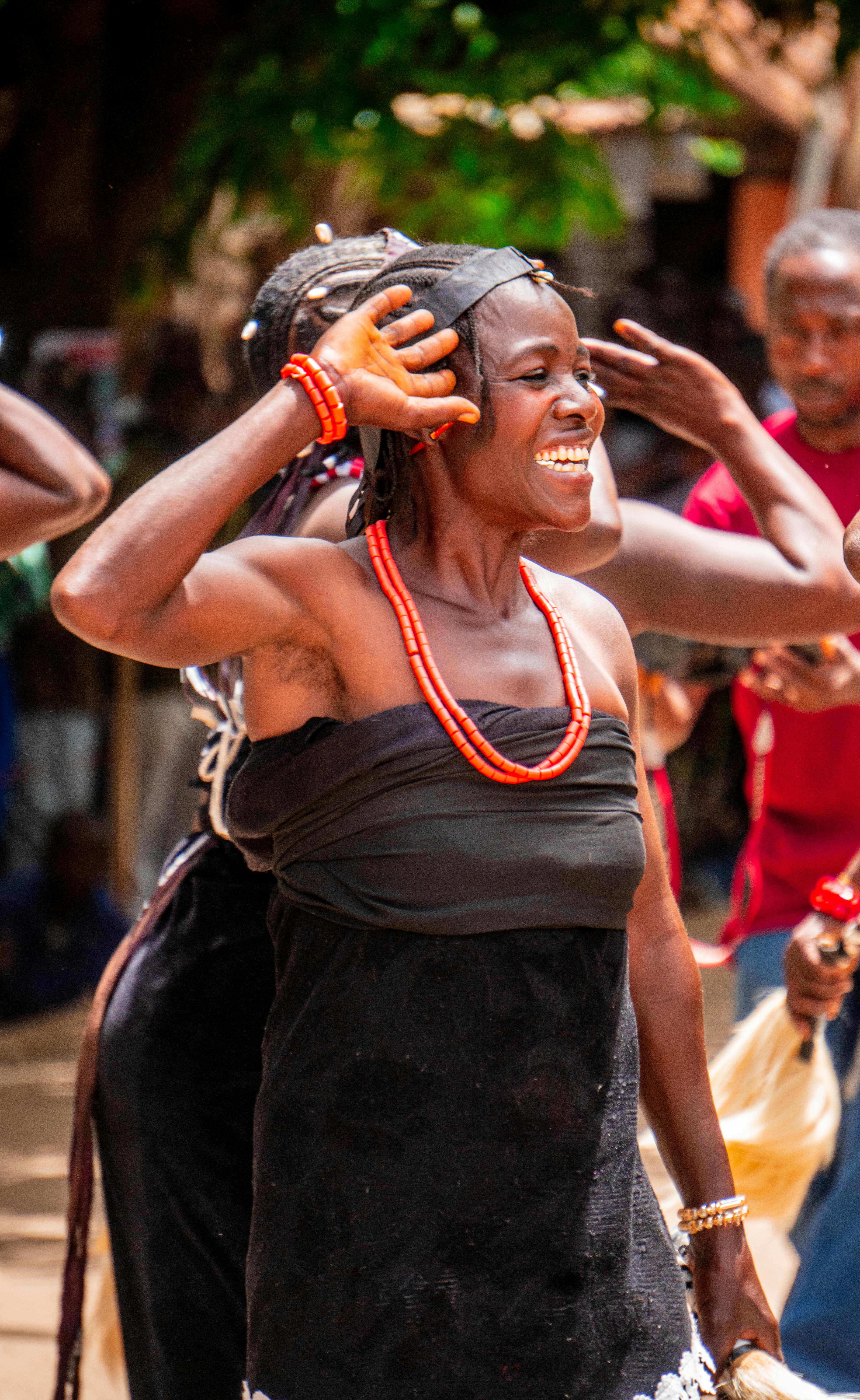 A woman in a black dress is dancing