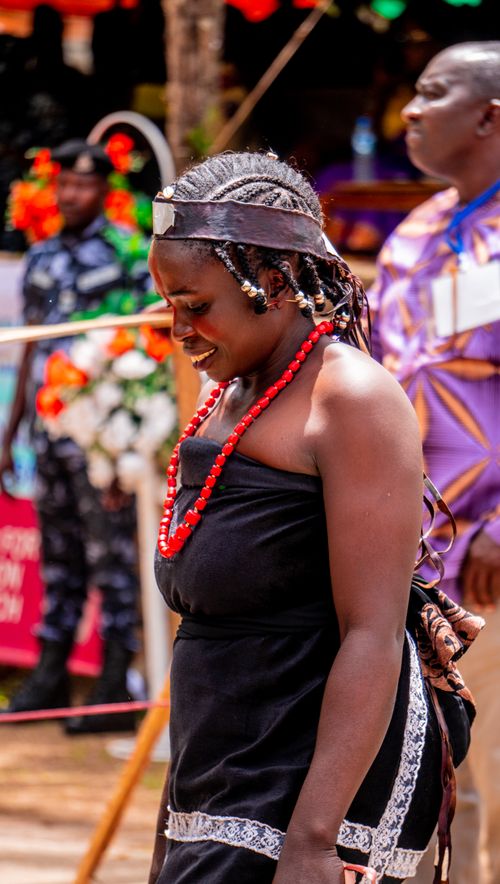 Free African woman in traditional attire at a vibrant cultural festival, showcasing rich heritage and joy. Stock Photo