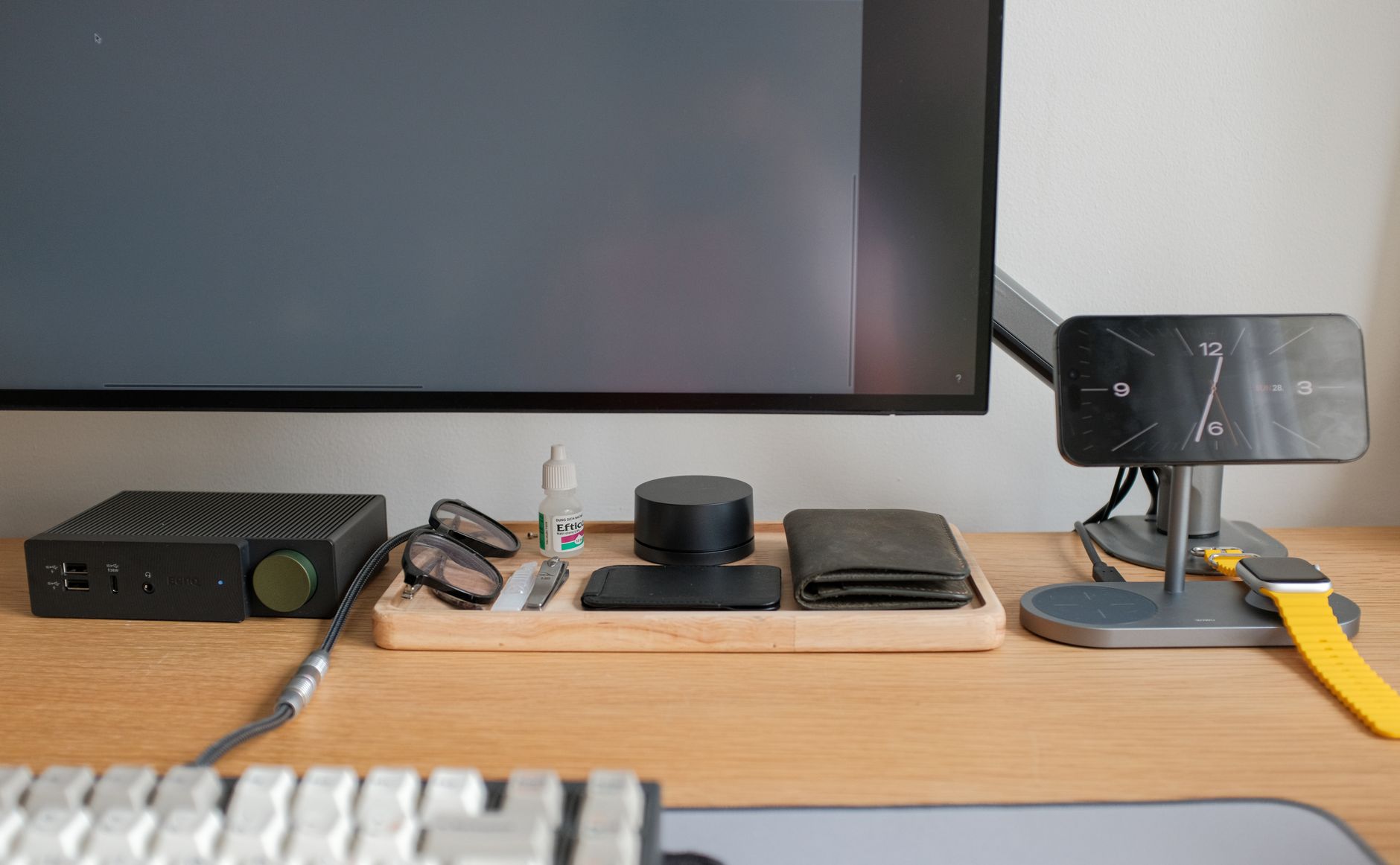 Google Coral TPU USB accelerator next to a mini PC and IP security camera on a desk