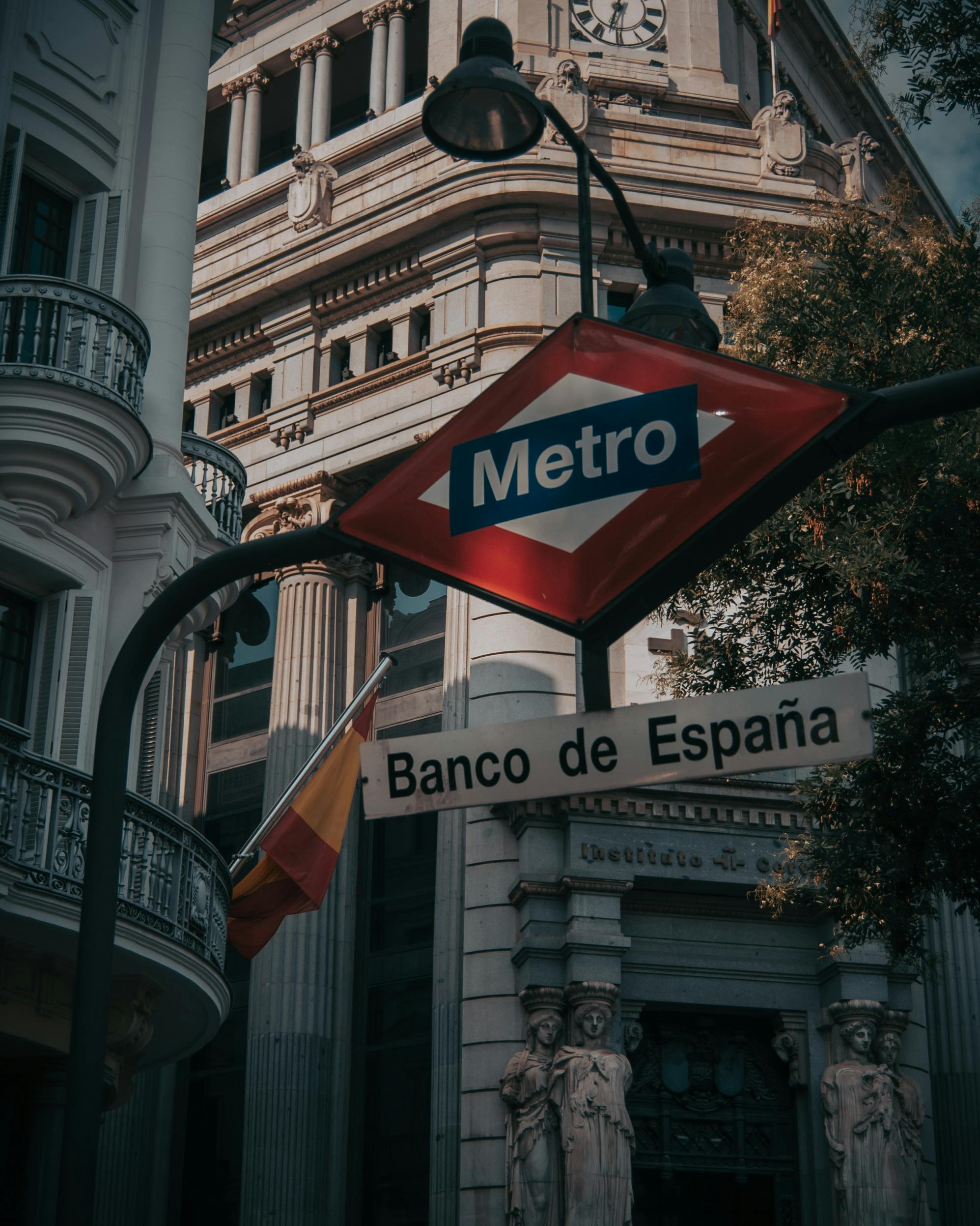 a sign that says metro and a street sign