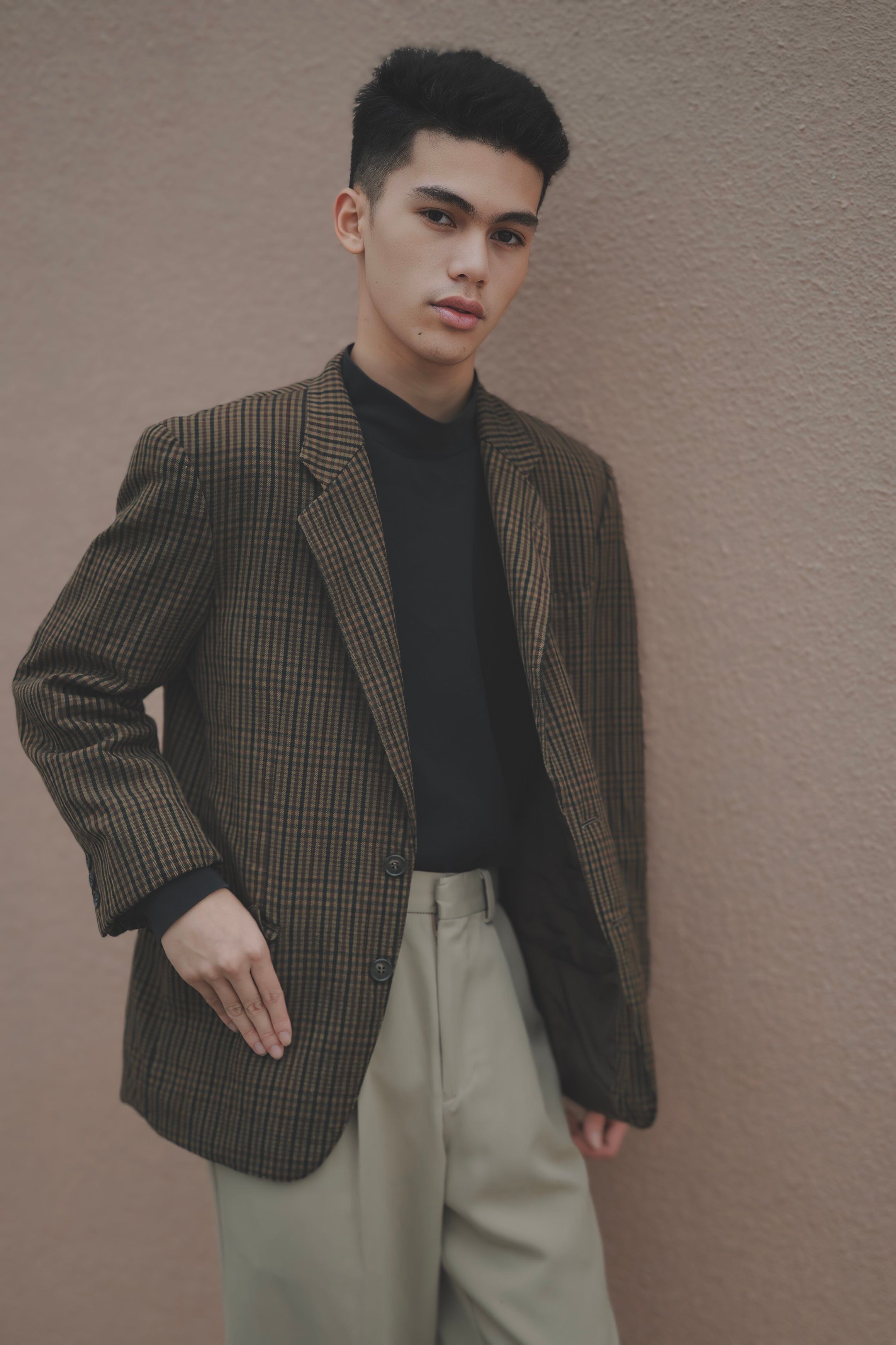 Man holding a sport coat jacket