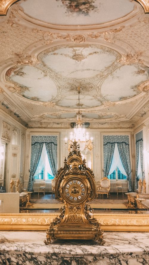 Free Magnificent baroque room with intricate ceiling and ornate clock in a palace in İstanbul. Stock Photo