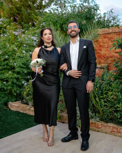 Free Stylish couple posing during their engagement ceremony outdoors in Nabeul, Tunisia. Stock Photo