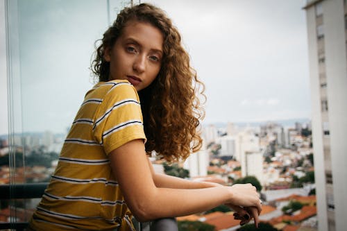 Woman Leaning on Railing