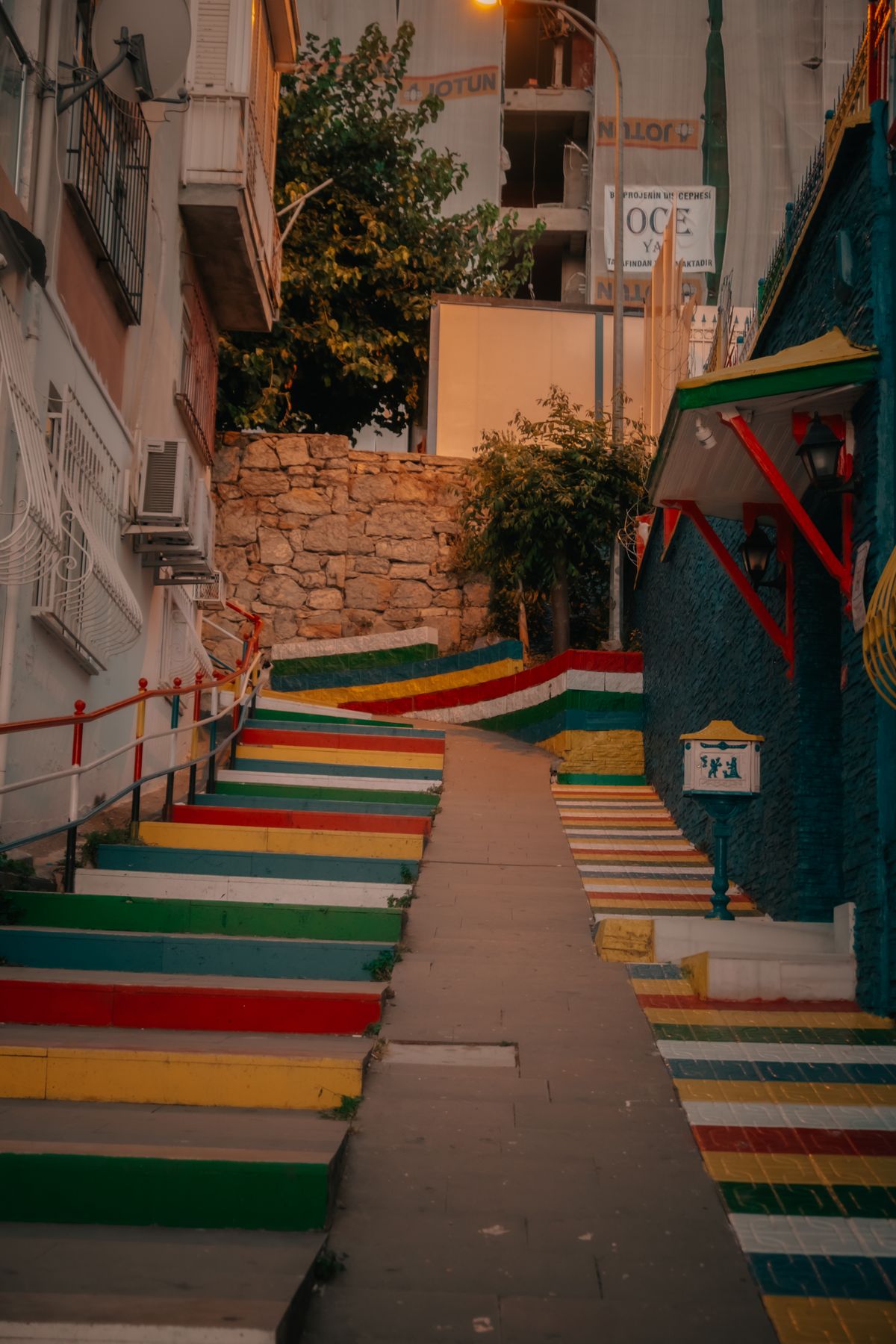 Colorful stairway leading upward, symbolizing Myron Golden's rise from garbage collector to business leader