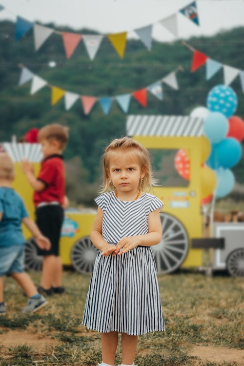 Free Photo of Girl Wearing Striped Dress Stock Photo