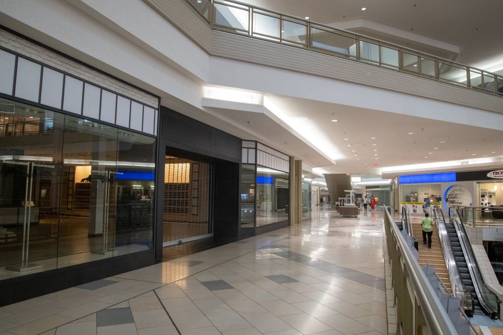 Empty retail corridor with storefront bays