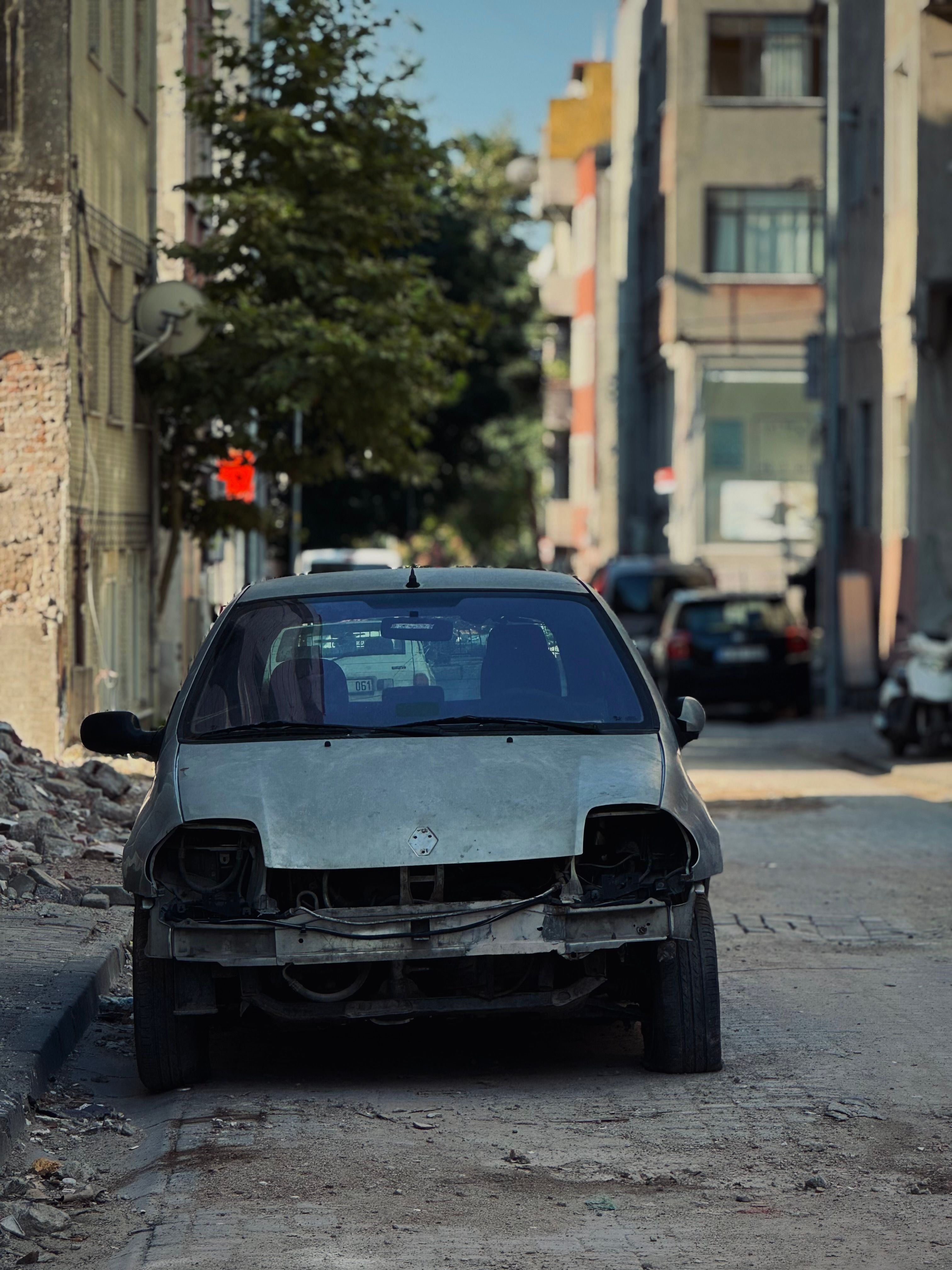 A car is parked on the side of a street · Free Stock Photo