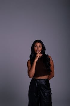 Stylish portrait of a young woman in edgy attire, exuding confidence and elegance.