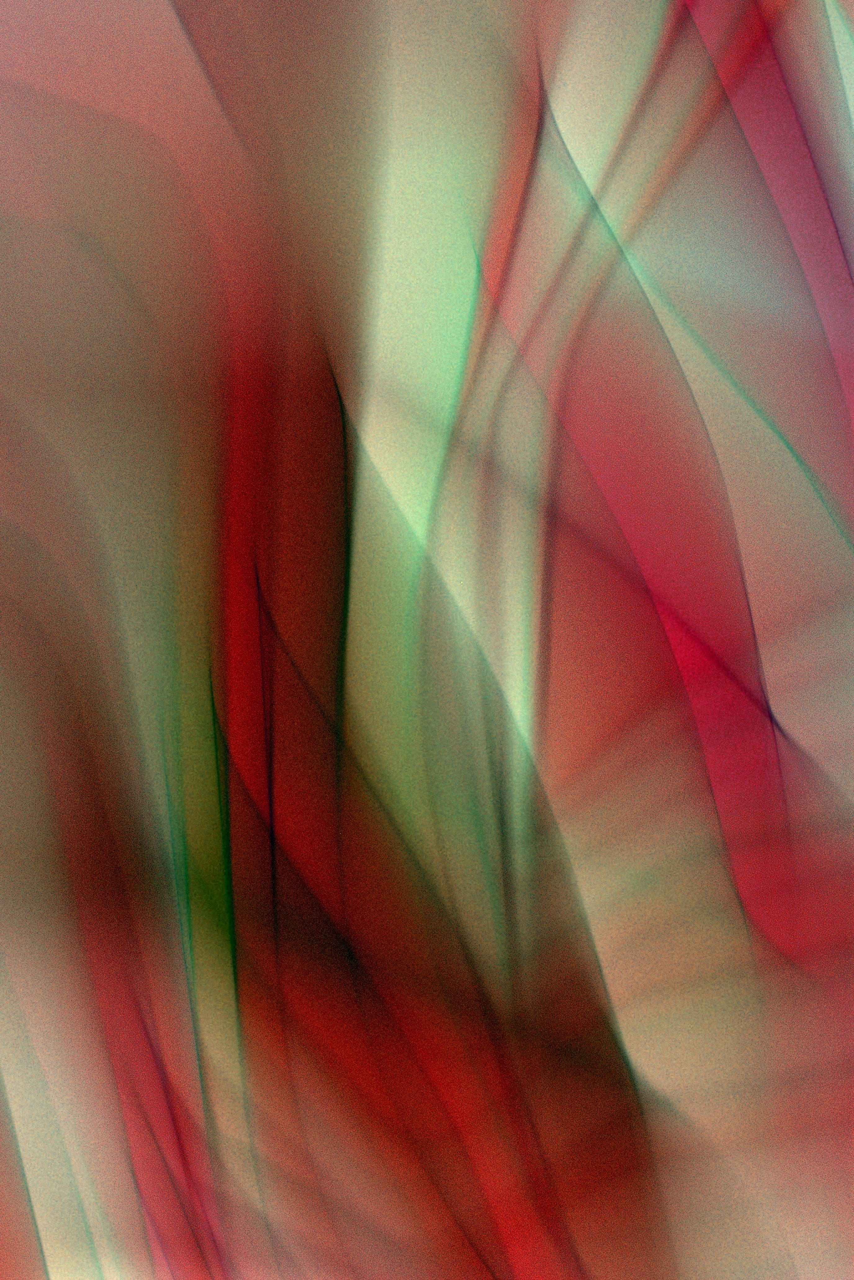Dynamic abstract art displaying multicolor flowing patterns with a smooth and surreal aesthetic.