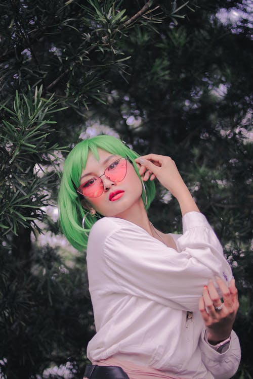 Woman With Green Hair Wearing Hoop Earrings