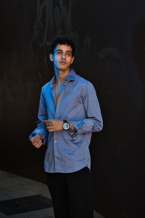 Free Portrait of a fashionable young man wearing a blue shirt outdoors in Berlin. Stock Photo