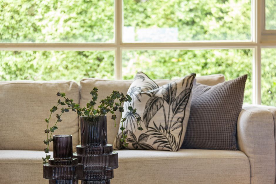 living room refresh with new cushions and plants