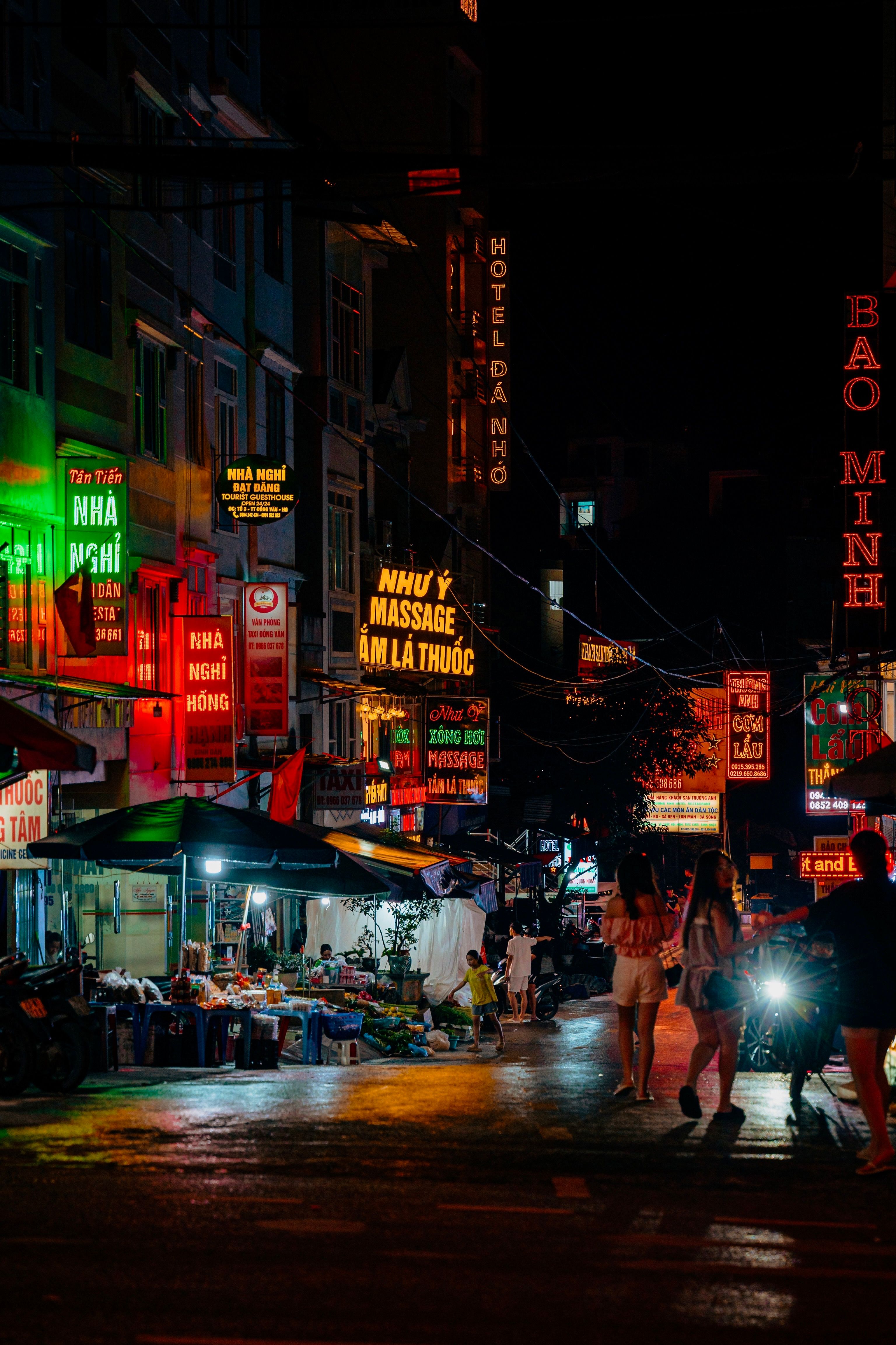 Explore the lively nightlife of Hà Giang with bustling street markets and colorful neon lights.