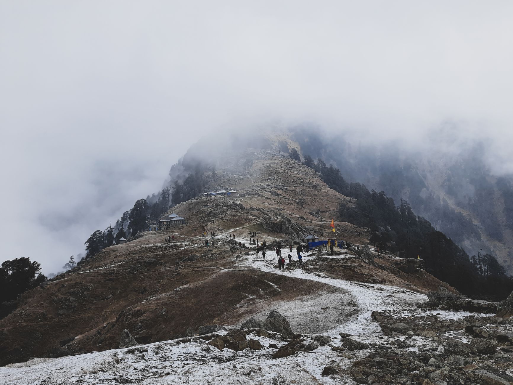 Explore the stunning Triund hike in winter mist. Perfect for adventure travel in Dharamshala, India.