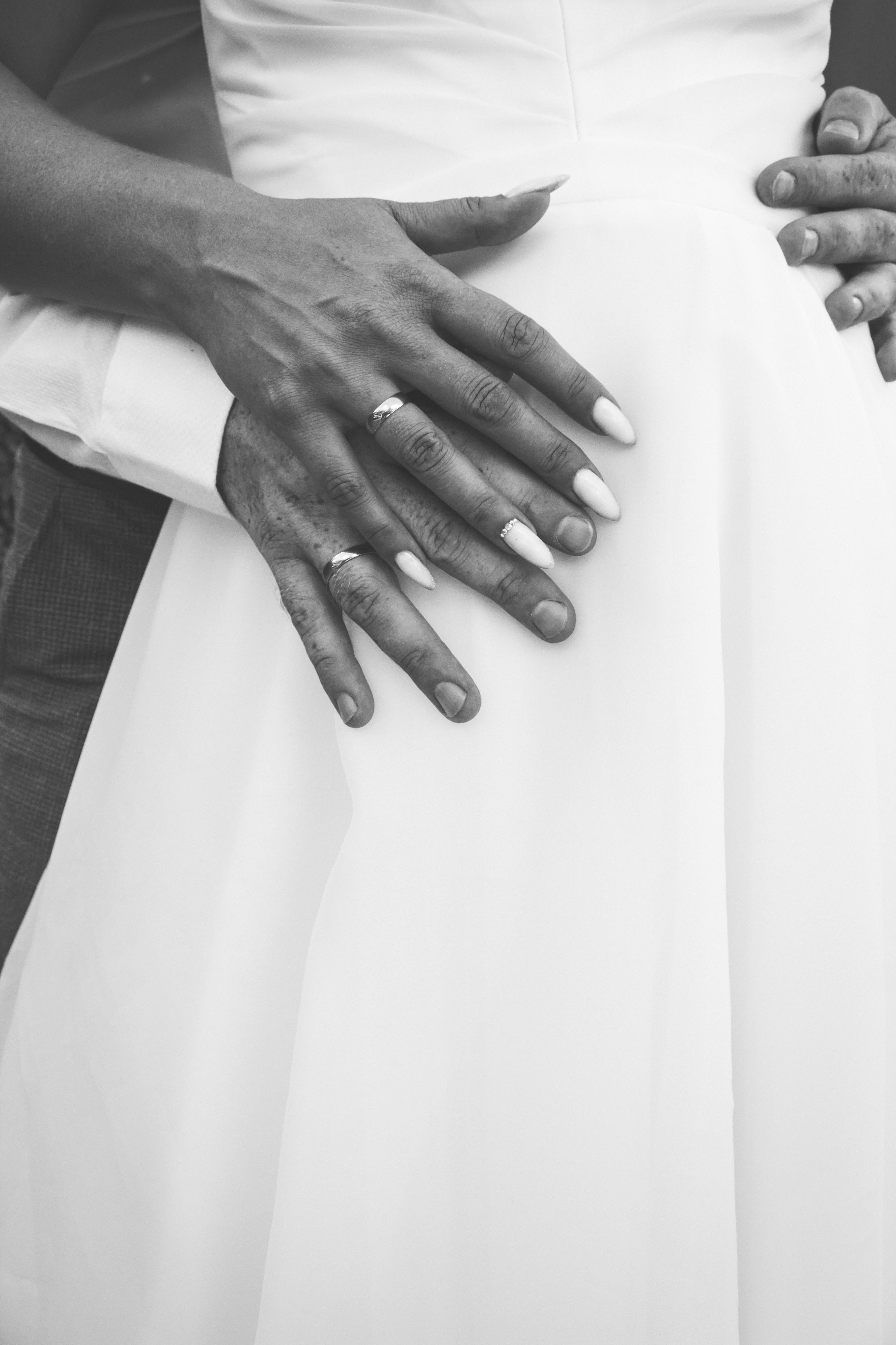 a black and white photo of a bride and groom