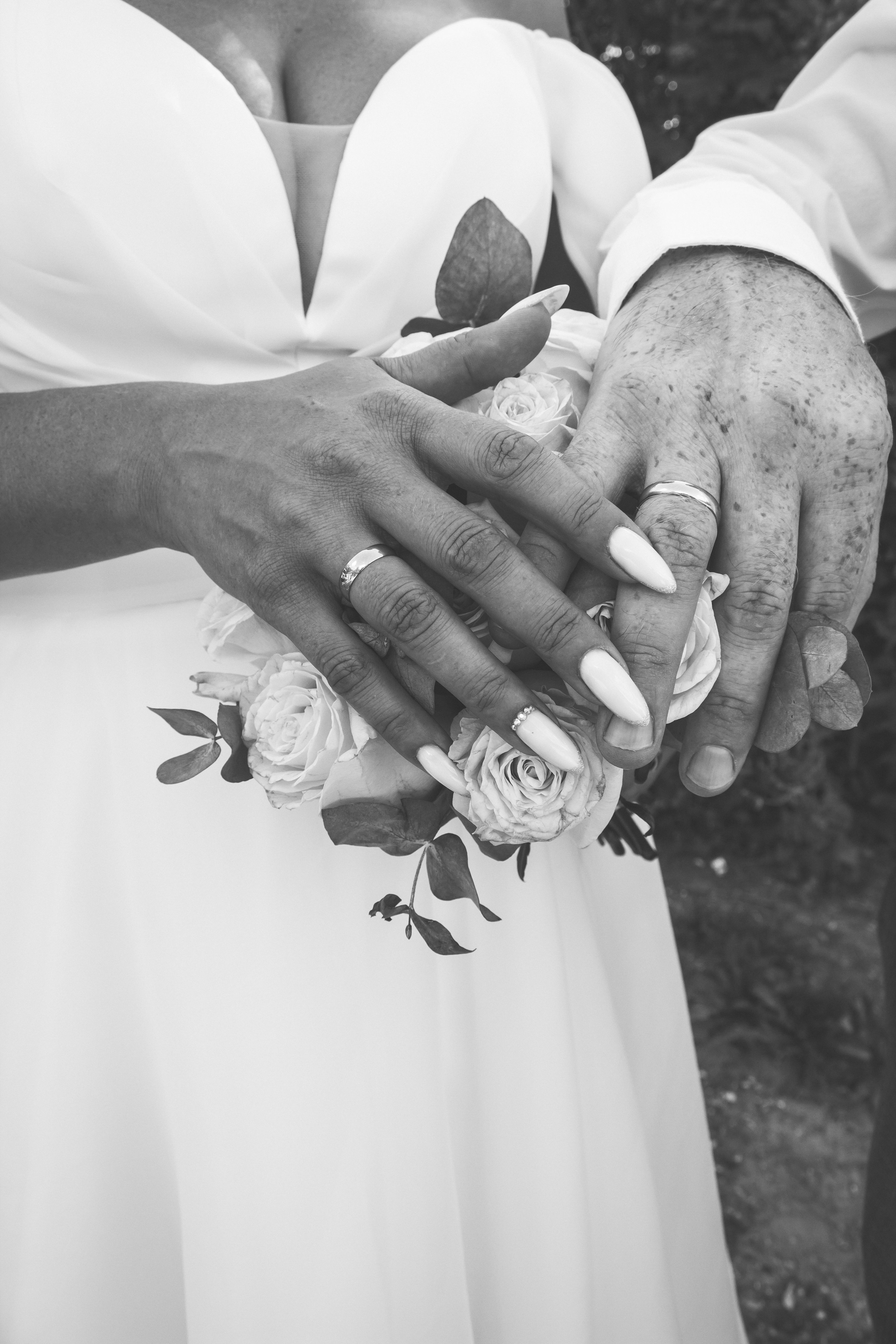 A black and white photo of a bride and groom holding hands · Free Stock ...