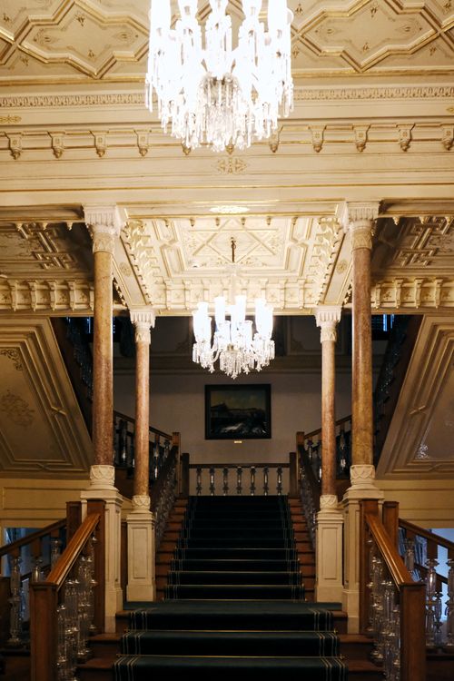 Free Luxurious palace staircase in Istanbul with ornate design and chandeliers. Stock Photo