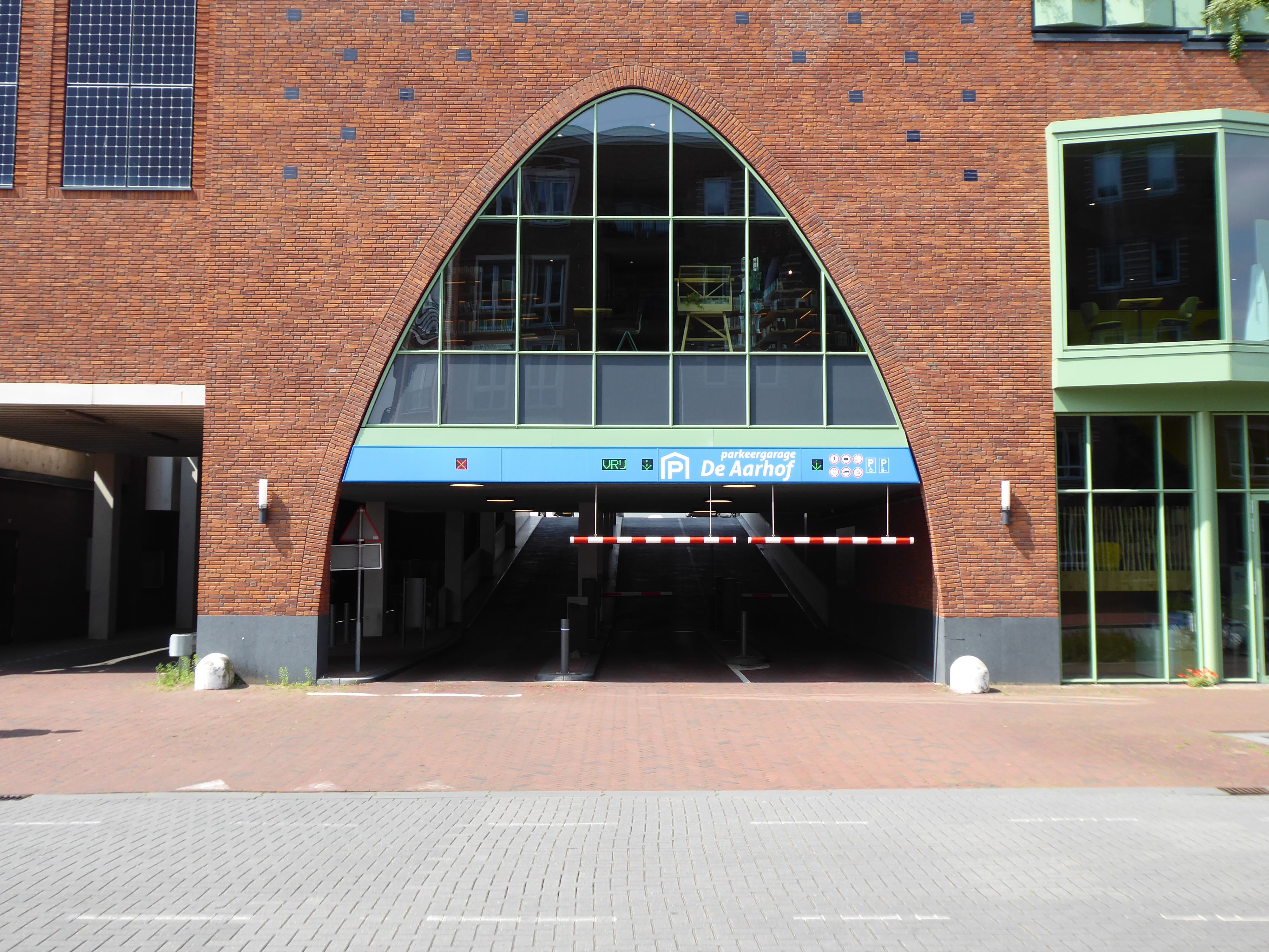 A controlled-access garage entrance providing a secure environment for vehicles - apartment garage parking