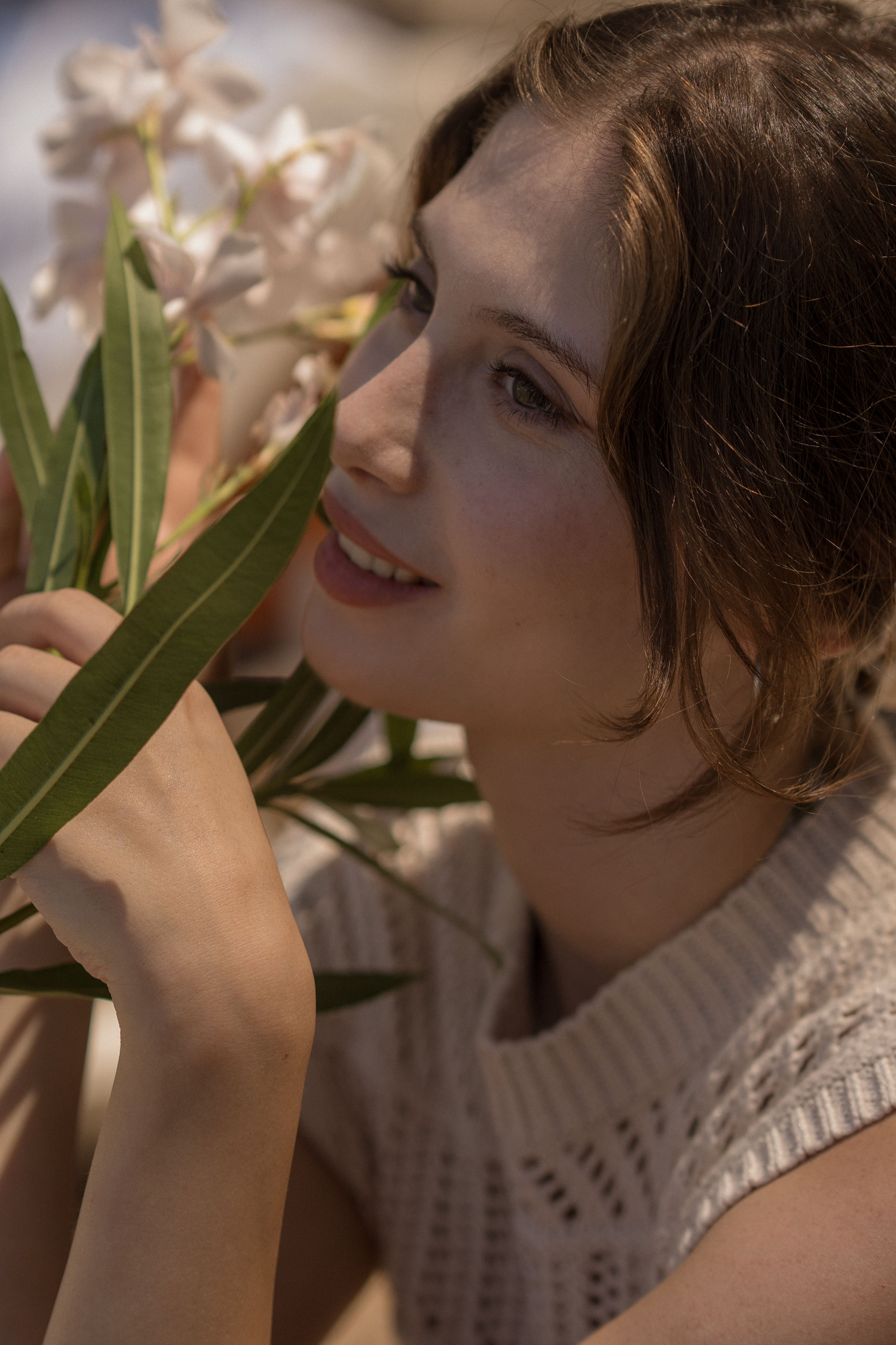A woman holding a bunch of flowers in her hand · Free Stock Photo