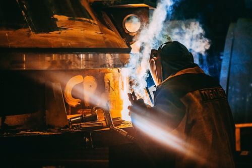 Free Person Wearing Gray Jacket and Welding Helmet Stock Photo