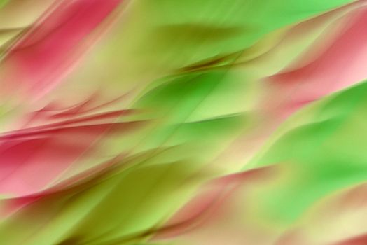 Colorful abstract pattern with vibrant waves of green and pink, perfect for artistic backgrounds or digital designs.