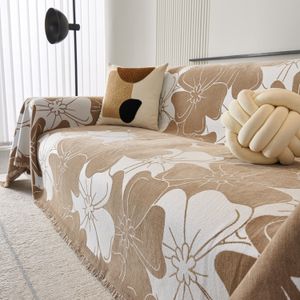 Sofa dressed in a patterned throw and cushions, photo by SlipcoverKAS on Pexels