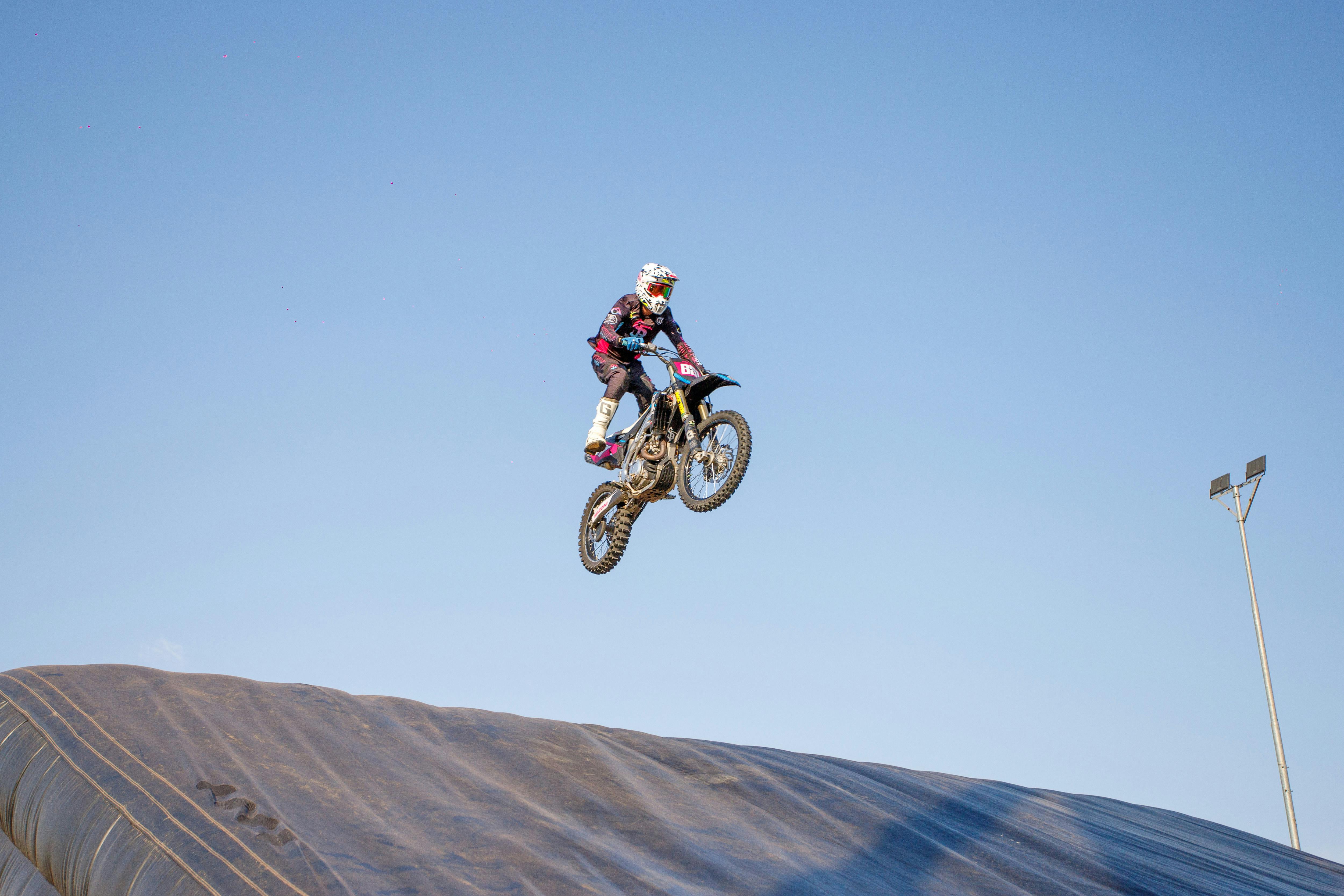 man jumping on motocross motorbike