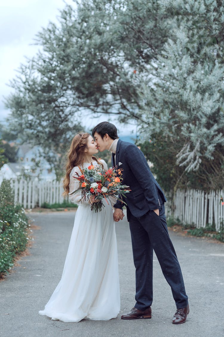 Bride And Groom Kissing Each Other